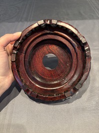 A collection of 38 Chinese wooden stands and a box, 19/20th C.