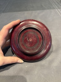 A collection of 38 Chinese wooden stands and a box, 19/20th C.