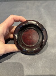 A collection of 38 Chinese wooden stands and a box, 19/20th C.