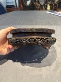 A collection of 38 Chinese wooden stands and a box, 19/20th C.