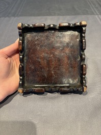 A collection of 38 Chinese wooden stands and a box, 19/20th C.