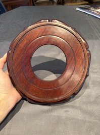 A collection of 38 Chinese wooden stands and a box, 19/20th C.