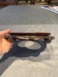 A collection of 38 Chinese wooden stands and a box, 19/20th C.