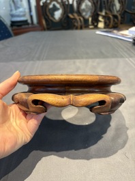 A collection of 38 Chinese wooden stands and a box, 19/20th C.