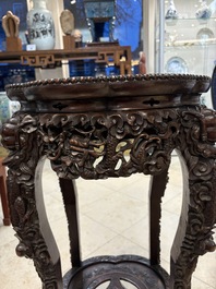 Two finely carved Chinese marble-topped hongmu stands, 19th C.