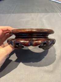 A collection of 38 Chinese wooden stands and a box, 19/20th C.