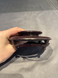 A collection of 38 Chinese wooden stands and a box, 19/20th C.