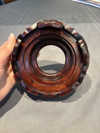 A collection of 38 Chinese wooden stands and a box, 19/20th C.