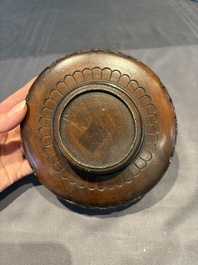 A collection of 38 Chinese wooden stands and a box, 19/20th C.