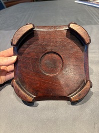 A collection of 38 Chinese wooden stands and a box, 19/20th C.