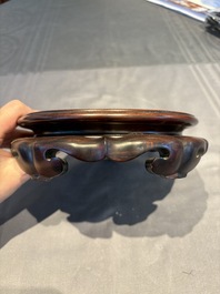 A collection of 38 Chinese wooden stands and a box, 19/20th C.