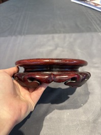 A collection of 38 Chinese wooden stands and a box, 19/20th C.