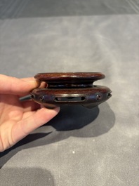 A collection of 38 Chinese wooden stands and a box, 19/20th C.