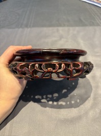 A collection of 38 Chinese wooden stands and a box, 19/20th C.