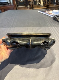 A collection of 38 Chinese wooden stands and a box, 19/20th C.