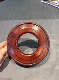 A collection of 38 Chinese wooden stands and a box, 19/20th C.