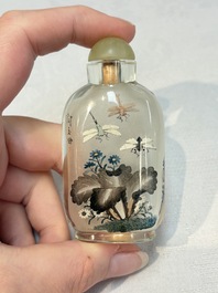 A Chinese rock crystal and two glass inside painted snuff bottles, 19/20th C., with a signed copy of 'Chinese Inside Painting of the Modern Age', 2005