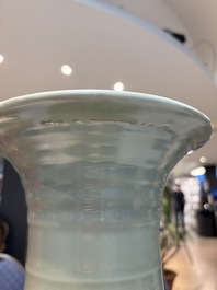 A Chinese celadon-glazed vase with relief lotus scroll design, 18th C.