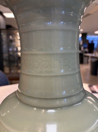 A Chinese celadon-glazed vase with relief lotus scroll design, 18th C.
