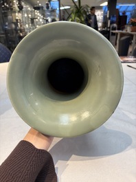 A Chinese celadon-glazed vase with relief lotus scroll design, 18th C.