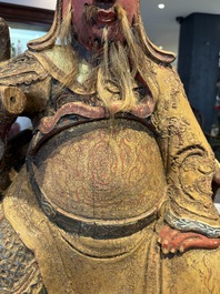 A large Chinese gilt-lacquered and polychrome wooden figure of Guandi, 19th C.