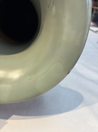 A Chinese celadon-glazed vase with relief lotus scroll design, 18th C.