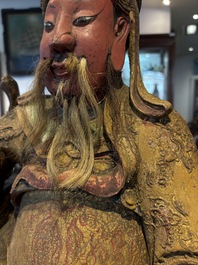 A large Chinese gilt-lacquered and polychrome wooden figure of Guandi, 19th C.