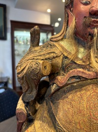 A large Chinese gilt-lacquered and polychrome wooden figure of Guandi, 19th C.