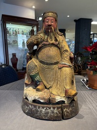 A large Chinese gilt-lacquered and polychrome wooden figure of Guandi, 19th C.