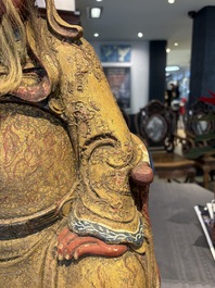 A large Chinese gilt-lacquered and polychrome wooden figure of Guandi, 19th C.