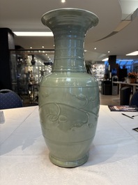 A Chinese celadon-glazed vase with relief lotus scroll design, 18th C.