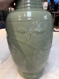 A Chinese celadon-glazed vase with relief lotus scroll design, 18th C.