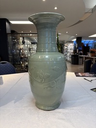 A Chinese celadon-glazed vase with relief lotus scroll design, 18th C.