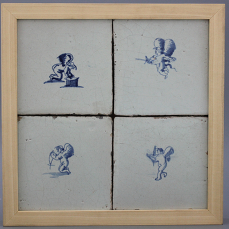 A framed set of 4 Dutch Delft tiles with amors 17th C.