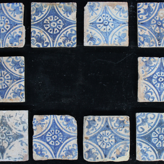 A group of 10 Manises tiles blue and white, 16th C. and one lozenge shaped tile, 17th C.