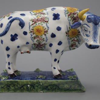 A polychrome Dutch Delft cow, 18th C.