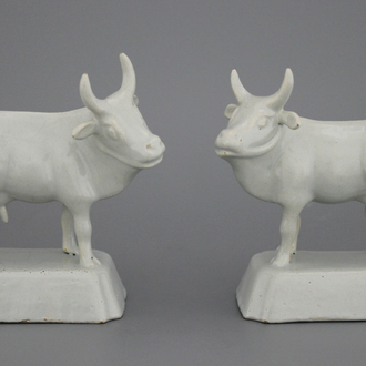 A pair of Dutch Delft monochrome white figures of cows, 18th C.