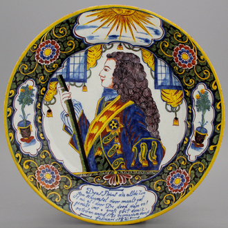 An important commemorative royalist Dutch Delft portrait dish with mixed technique border, reinforced with black and dated ca. 1752