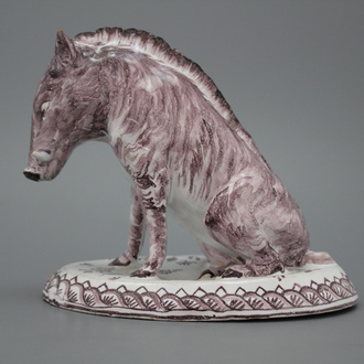 A Dutch Delft manganese faience model of a wild boar, marked AP