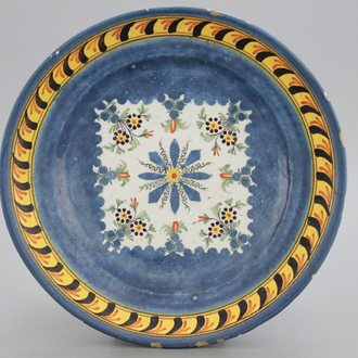 A Brussels faience blue ground plate, early 19th C.