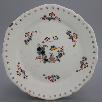 A Brussels faience lobed "floral hedge" plate, 18th C.