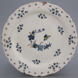 A Brussels faience lobed "floral hedge" plate, 18th C.