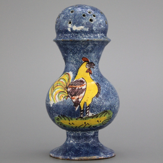 A rare Brussels faience caster with a rooster, 18th C.