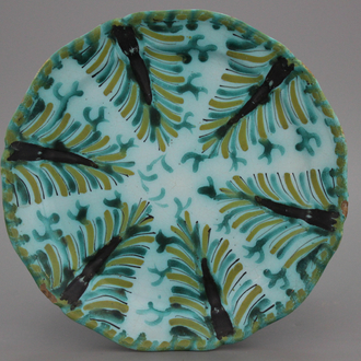 A lobed Brussels faience dish with leaf patterns, 18th C