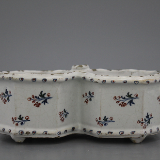 A Brussels faience "floral hedge" cruet stand, 18th C.