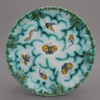 A notched Brussels faience butterfly plate, 18th C.