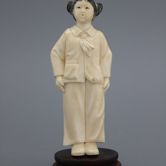 A Chinese carved ivory figure of a girl, Cultural Revolution, 20th C.