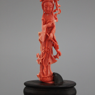 A carved Chinese red coral figure of a guanyin, 19/20th C.