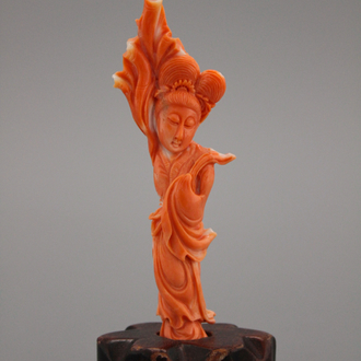 A carved Chinese red coral figure of a Guanyin , 19/20th C.
