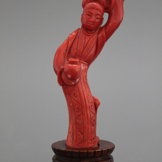 A carved Chinese red coral figure of a Guanyin, 19th C.